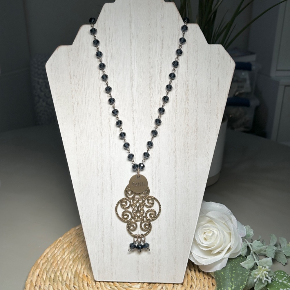 Mac and Me long necklace features a beautiful filigreed hammered brass pendant